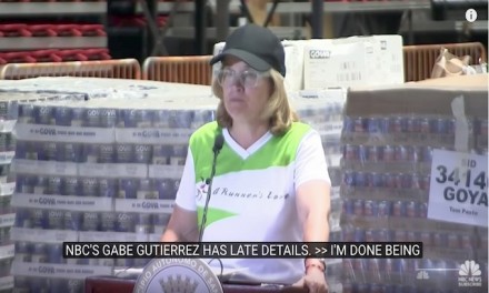 Mayor stands amid pallets of supplies to complain she has no help