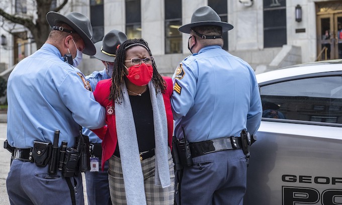 Georgia Gov. Brian Kemp signs sweeping election rule changes into law; Democrat arrested